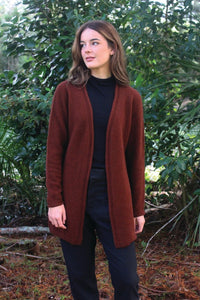 Possum and Merino.  9785 Curb Jacket - Flattering open fronted longer line jacket with roll detail on front edge and cuffs.    Made in New Zealand from a premium blend of 40% possum fur, 50% merino & 10% nylon.