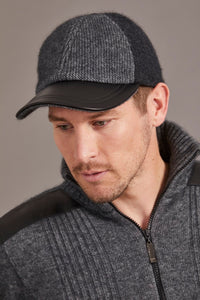 6071 Contrast Leather Peak Cap - Perfect piece for all ages, this Possum Merino cap is a timeless piece created with an artistic accent - keep the cold and the winter sun out. Step outdoors and make a statement. Intrinsically created from quality Possum Merino blended with luxurious Mulberry Silk and finished with a fine, genuine Lambskin Peak, you are sure to receive a quality warmth.