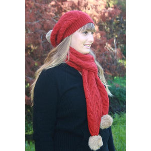 9873 Cable Scarf with Rabbit Fur Pompoms - Soft Chunky cable scarf with rabbit fur pompoms.  Charcoal, Natural, Pumpkin and Raspberry have a natural fur pompoms.  Black has a Black fur pompoms.  Raspberry and Silver have Silver fur pompoms.