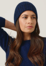 Load image into Gallery viewer, Possum and Merino

0527 Rib Beanie - A heater for your head, this fitted Merinomink beanie is big on cosiness, but light to wear. Rib detail and Merinomink branding add a touch of designer detail. A slim fit.

Made in New Zealand from an exclusive Merinomink blend of 50% ZQ Merino, 40% Brushtail possum and 10% Mulberry silk.