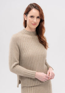Possum and Merino  Elegant and understated, the Emilia is a flattering sweater you'll want to wear every day. With a cosy funnel neck, raglan sleeves and rib details, it's a perfect match with the Emilia Skirt. Made with our signature Merinomink blend, it has you covered when it comes to keeping you warm without weighing you down.