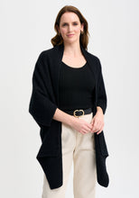 Load image into Gallery viewer, Possum and Merino

100276 Naomi Wrap - This clever little piece is part wrap and part cardi, and the best part - it can be flipped upside down. Want a longer silhouette, then wear it one way, want it cropped then turn it around! Featuring a pocket detail and a waterfall-style silhouette, this style can also be wrapped. Relaxed fit.

Made in New Zealand from an exclusive Merinomink blend of 50% ZQ Merino, 40% Brushtail possum and 10% Mulberry silk.