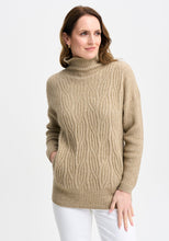 Load image into Gallery viewer, Possum and Merino

100295 Neve Sweater - Keep the cool out in style with the Neve Sweater. Designed with a longer silhouette for everyday comfort, it can easily dress up or down. Featuring cable detail through the body and a rib roll neck and sleeves, every detail is thoughtfully considered. Kangaroo pockets will keep cold hands cosy. Classic fit.&nbsp;

Made in New Zealand from an exclusive Merinomink blend of 50% ZQ Merino, 40% Brushtail possum and 10% Mulberry silk.