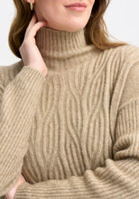 Load image into Gallery viewer, Possum and Merino

100295 Neve Sweater - Keep the cool out in style with the Neve Sweater. Designed with a longer silhouette for everyday comfort, it can easily dress up or down. Featuring cable detail through the body and a rib roll neck and sleeves, every detail is thoughtfully considered. Kangaroo pockets will keep cold hands cosy. Classic fit.&nbsp;

Made in New Zealand from an exclusive Merinomink blend of 50% ZQ Merino, 40% Brushtail possum and 10% Mulberry silk.