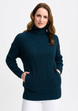 Load image into Gallery viewer, Possum and Merino

100295 Neve Sweater - Keep the cool out in style with the Neve Sweater. Designed with a longer silhouette for everyday comfort, it can easily dress up or down. Featuring cable detail through the body and a rib roll neck and sleeves, every detail is thoughtfully considered. Kangaroo pockets will keep cold hands cosy. Classic fit.&nbsp;

Made in New Zealand from an exclusive Merinomink blend of 50% ZQ Merino, 40% Brushtail possum and 10% Mulberry silk.