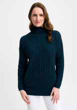 Load image into Gallery viewer, Possum and Merino

100295 Neve Sweater - Keep the cool out in style with the Neve Sweater. Designed with a longer silhouette for everyday comfort, it can easily dress up or down. Featuring cable detail through the body and a rib roll neck and sleeves, every detail is thoughtfully considered. Kangaroo pockets will keep cold hands cosy. Classic fit.&nbsp;

Made in New Zealand from an exclusive Merinomink blend of 50% ZQ Merino, 40% Brushtail possum and 10% Mulberry silk.