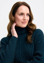 Load image into Gallery viewer, Possum and Merino

100295 Neve Sweater - Keep the cool out in style with the Neve Sweater. Designed with a longer silhouette for everyday comfort, it can easily dress up or down. Featuring cable detail through the body and a rib roll neck and sleeves, every detail is thoughtfully considered. Kangaroo pockets will keep cold hands cosy. Classic fit.&nbsp;

Made in New Zealand from an exclusive Merinomink blend of 50% ZQ Merino, 40% Brushtail possum and 10% Mulberry silk.