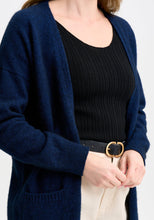 Load image into Gallery viewer, Possum and Merino

100297 Karla Coat Cardi - Looking for a longline cardi? Then you&#39;ve found it. This simple style has a long silhouette and two pockets will keep your hands cosy. Relaxed fit.&nbsp;

Made in New Zealand from an exclusive Merinomink blend of 50% ZQ Merino, 40% Brushtail possum and 10% Mulberry silk.