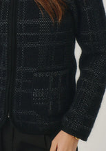 Load image into Gallery viewer, Possum and Merino

100298 Eloise Jacket - Eloise is all about style and grace. A refined silhouette and soft v neckline is met with a zipper that comes down to a curved front hem. A Merinomink zip pull and pockets add to the thoughtful design of this jacket. With a felted finish and subtle check detail, this new jacket is poised to become a highly coveted piece. Slim fit.&nbsp;

Made in New Zealand from an exclusive Merinomink blend of 50% ZQ Merino, 40% Brushtail possum and 10% Mulberry silk.