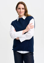 Load image into Gallery viewer, Possum and Merino

100299 Claudia Vest - Worn with bare arms in warmer weather, or layered over a shirt or merino top in winter, the Claudia has you covered for any occasion. Subtle angled stitch detail features on the front, and a dipped back hem delivers and elongating silhouette. Classic fit.&nbsp;

Made in New Zealand from an exclusive Merinomink blend of 50% ZQ Merino, 40% Brushtail possum and 10% Mulberry silk.