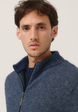 Load image into Gallery viewer, Possum and Merino

100350 Whittaker Zip Jacket - This classic jacket is a go-to piece with pockets and contrast striped collar. Featuring a Merinomink zip pull, its ready for whatever the weather throws at you. A classic fit.

Made in New Zealand from an exclusive Merinomink blend of 50% ZQ Merino, 40% Brushtail possum and 10% Mulberry silk.