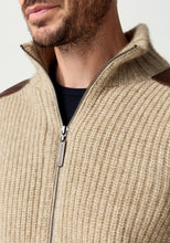 Load image into Gallery viewer, Possum and Merino

100392 Forrester Jacket - Crafted with a distinctive fisherman rib knit, this jacket combines timeless design with considered detailing. Leather shoulder patches and leather-trimmed pockets lend a heritage-inspired character, while the signature Merinomink zip pull provides a refined finishing touch. A versatile layer designed for enduring style and comfort.

Made in New Zealand from a blend of 40% possum fur, 50% ZQ merino and 10% mulberry silk.