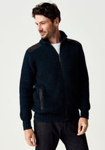 Load image into Gallery viewer, Possum and Merino

100392 Forrester Jacket - Crafted with a distinctive fisherman rib knit, this jacket combines timeless design with considered detailing. Leather shoulder patches and leather-trimmed pockets lend a heritage-inspired character, while the signature Merinomink zip pull provides a refined finishing touch. A versatile layer designed for enduring style and comfort.

Made in New Zealand from a blend of 40% possum fur, 50% ZQ merino and 10% mulberry silk.