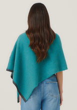 Load image into Gallery viewer, Possum and Merino

1623 Two Tone Poncho - A fan favourite, the Two Tone Poncho is a winner. With a relaxed fit and contrast coloured tipping it&#39;s cut for comfort and style. With a rainbow of colour options on offer, this is one you&#39;ll want in each colour! Classic fit.&nbsp;

Made in New Zealand from an exclusive Merinomink blend of 50% ZQ Merino, 40% Brushtail possum and 10% Mulberry silk.