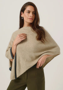 Possum and Merino

1623 Two Tone Poncho - A fan favourite, the Two Tone Poncho is a winner. With a relaxed fit and contrast coloured tipping it's cut for comfort and style. With a rainbow of colour options on offer, this is one you'll want in each colour! Classic fit.&nbsp;

Made in New Zealand from an exclusive Merinomink blend of 50% ZQ Merino, 40% Brushtail possum and 10% Mulberry silk.