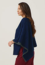 Load image into Gallery viewer, Possum and Merino

1623 Two Tone Poncho - A fan favourite, the Two Tone Poncho is a winner. With a relaxed fit and contrast coloured tipping it&#39;s cut for comfort and style. With a rainbow of colour options on offer, this is one you&#39;ll want in each colour! Classic fit.&nbsp;

Made in New Zealand from an exclusive Merinomink blend of 50% ZQ Merino, 40% Brushtail possum and 10% Mulberry silk.