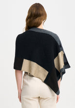 Load image into Gallery viewer, Possum and Merino

1677 Empress Poncho - The Empress should have been called impress, as you&#39;ll be sure to turn heads in this one! With its bold colour blocking and timeless design, the Empress Poncho is statement piece you&#39;ll love.

Made in New Zealand from an exclusive Merinomink blend of 50% ZQ Merino, 40% Brushtail possum and 10% Mulberry silk.