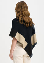 Load image into Gallery viewer, Possum and Merino

1677 Empress Poncho - The Empress should have been called impress, as you&#39;ll be sure to turn heads in this one! With its bold colour blocking and timeless design, the Empress Poncho is statement piece you&#39;ll love.

Made in New Zealand from an exclusive Merinomink blend of 50% ZQ Merino, 40% Brushtail possum and 10% Mulberry silk.