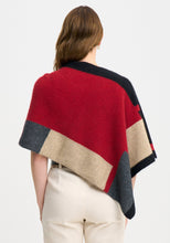 Load image into Gallery viewer, Possum and Merino

1677 Empress Poncho - The Empress should have been called impress, as you&#39;ll be sure to turn heads in this one! With its bold colour blocking and timeless design, the Empress Poncho is statement piece you&#39;ll love.

Made in New Zealand from an exclusive Merinomink blend of 50% ZQ Merino, 40% Brushtail possum and 10% Mulberry silk.