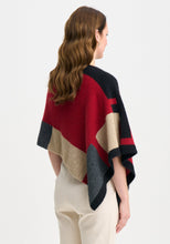 Load image into Gallery viewer, Possum and Merino

1677 Empress Poncho - The Empress should have been called impress, as you&#39;ll be sure to turn heads in this one! With its bold colour blocking and timeless design, the Empress Poncho is statement piece you&#39;ll love.

Made in New Zealand from an exclusive Merinomink blend of 50% ZQ Merino, 40% Brushtail possum and 10% Mulberry silk.