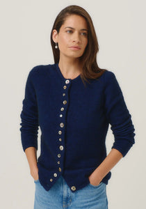 Possum and Merino

1736 Shell Cardi - Our signature Shell Cardi is a Merinomink staple, loved for its simple lines and statement buttons. A fitted silhouette offers a smart and refined look that can dress and up and down with ease. Slim fit.&nbsp;

Made in New Zealand from an exclusive Merinomink blend of 50% ZQ Merino, 40% Brushtail possum and 10% Mulberry silk.