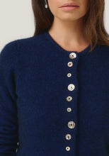 Load image into Gallery viewer, Possum and Merino

1736 Shell Cardi - Our signature Shell Cardi is a Merinomink staple, loved for its simple lines and statement buttons. A fitted silhouette offers a smart and refined look that can dress and up and down with ease. Slim fit.&nbsp;

Made in New Zealand from an exclusive Merinomink blend of 50% ZQ Merino, 40% Brushtail possum and 10% Mulberry silk.