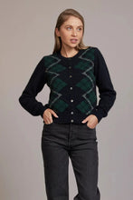 Load image into Gallery viewer, Possum and Merino  5045 Tartan Cardigan – A beautiful Tartan jacquard cardigan featuring beautiful shell buttons, knitted from the most luxurious of natural fibres for warmth and softness, this New Zealand-made classic button-up cardigan is a must on your wardrobe investment.  Light-weight warmth Tartan jacquard front Round neckline 35% Possum Fur, 55% Merino Wool, 10% Pure Mulberry Silk New Zealand designed and made