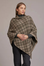 Load image into Gallery viewer, Possum and Merino  5051 Tartan Poncho – Possum and Merino  Our new Tartan Poncho is available in three beautiful colour combinations.  The incredible drape and classic style of this poncho will make it your go-to piece whenever there is a chill in the air.  All-over Tartan Pattern Mid-weight Warmth 35% Possum Fur, 55% Merino Wool, 10% Pure Mulberry Silk