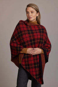 Possum and Merino  5051 Tartan Poncho – Possum and Merino  Our new Tartan Poncho is available in three beautiful colour combinations.  The incredible drape and classic style of this poncho will make it your go-to piece whenever there is a chill in the air.  All-over Tartan Pattern Mid-weight Warmth 35% Possum Fur, 55% Merino Wool, 10% Pure Mulberry Silk