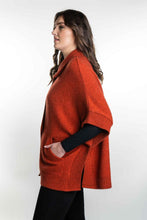 Load image into Gallery viewer, Possum and Merino  KO552 Cape with Pockets - An easy to wear piece which features ribbed trims, knitted-in pockets and beautiful textured buttons.  This garment is ideal for layering and is a relaxed fit.  Made proudly in New Zealand from a premium blend of 40% possum fur, 50% merino lambswool &amp; 10% mulberry silk.  