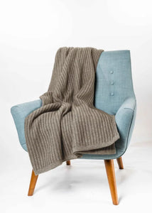 Possum and Merino  KO91 Ribbed Throw - Luxurious, generously sized throw in a chunky ribbed knit.  One size - Approx\.  140cm x 180cm  Made proudly in New Zealand from a premium blend of 40% possum fur, 50% merino lambswool & 10% mulberry silk. 