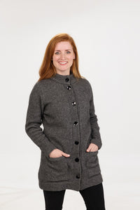 Possum and Merino  NS869 Essential Coat – This coat features a longer length, knit roll pockets, and shell buttons with traditional closure - a wardrobe classic   Fitting Style – Regular fit - A classic, standard fit.   Yarn: Essential Blend - 30% Possum fibre, 60% Superfine Merino wool (17.5 Micron), 10% Silk