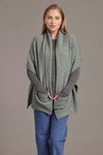 Load image into Gallery viewer, 033 Wrap with Pockets - Nature is the best source of inspiration and education - natural fibres of Possum Merino and Silk show just how nature&#39;s intelligence is at work.  With its incredible warmth and softness without bulk this Possum Merino wrap is a wardrobe piece you won&#39;t be able to resist.  Rib detailing, stylish length and deep pockets make this garment anything but humdrum.