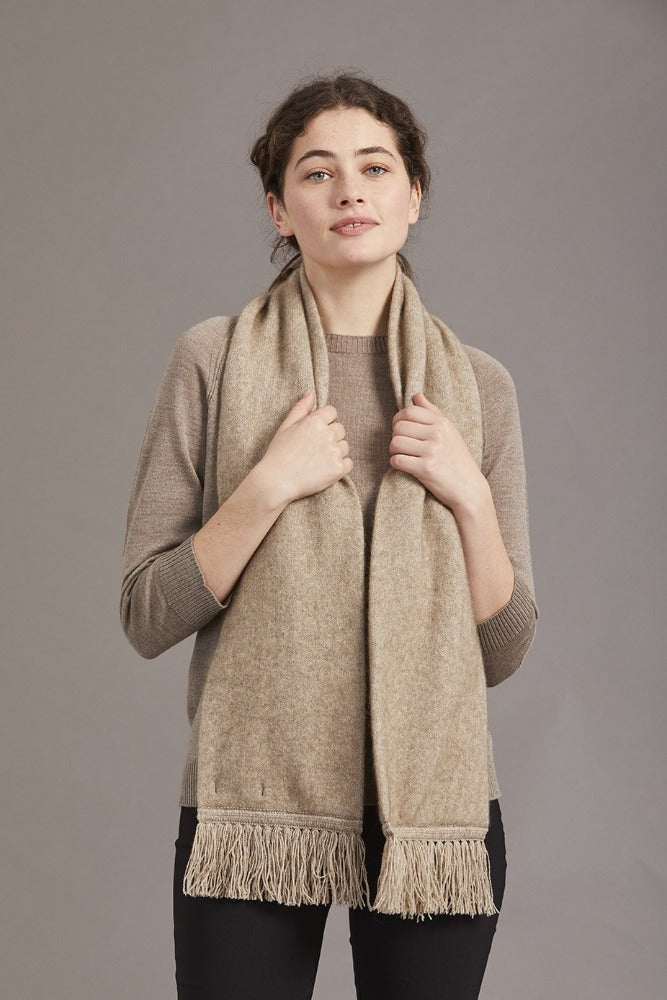 674 Plain Tubular Scarf - You cannot go wrong with the classic fringed Plain tubular scarf. This Possum Merino neck scarf blended with Mulberry Silk is the perfect way to keep warm with its double thickness. Tie it how you like and step out in style.  Match this with our 675 Plain Tubular Beanie,  style 675, to create the simple, yet attractive look.