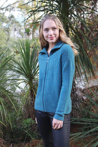 9774 Rangitoto Cable Jacket - Beautifully detailed cable sweeps around the shoulder area.  Moss stitch accents on the hem, cuffs, zip trim and collar. 