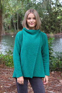 Possum and Merino  9780 Enfold Jacket - This cosy jacket fastens with a cross over front that buttons either side of the shoulder.  The front can be draped when worn open.  This garment is knitted sideways and runs up to 3XL size.