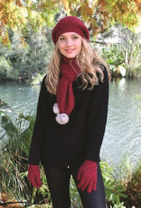 9873 Cable Scarf with Rabbit Fur Pompoms - Soft Chunky cable scarf with rabbit fur pompoms.  Charcoal, Natural, Pumpkin and Raspberry have a natural fur pompoms.  Black has a Black fur pompoms.  Raspberry and Silver have Silver fur pompoms.