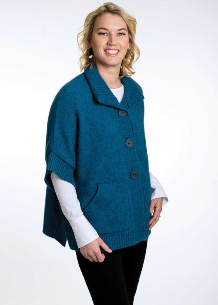 Possum and Merino  KO552 Cape with Pockets - An easy to wear piece which features ribbed trims, knitted-in pockets and beautiful textured buttons.  This garment is ideal for layering and is a relaxed fit.  Made proudly in New Zealand from a premium blend of 40% possum fur, 50% merino lambswool & 10% mulberry silk.  