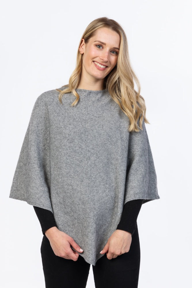 Possum & Merino.  NB698 Poncho (plain) - A classic, crew neck poncho in a light weight finish.  Available in a variety of colours.