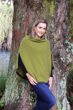 Load image into Gallery viewer, Possum and Merino  Z145 Verge Poncho - Striking and practical this softly draped turtleneck poncho features slits for ease of arm movement.  A small contrast stripe accents the soft curve of the hemline.